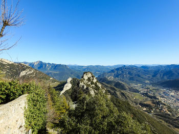 Scenic view of mountains against clear blue sky