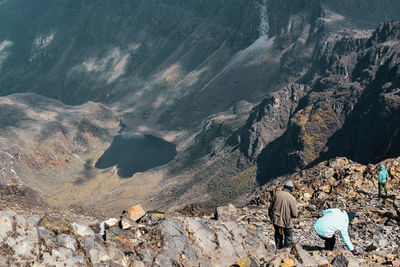 A group of hikers in the panoramic mountain landscapes in rwenzori mountains