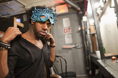 Young actor preparing backstage at a theater