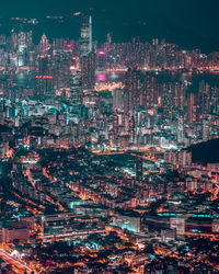 High angle view of illuminated buildings in city at night