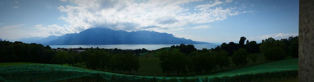 Scenic view of mountains against cloudy sky