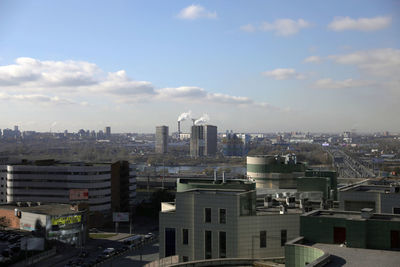 High angle view of buildings in city against sky