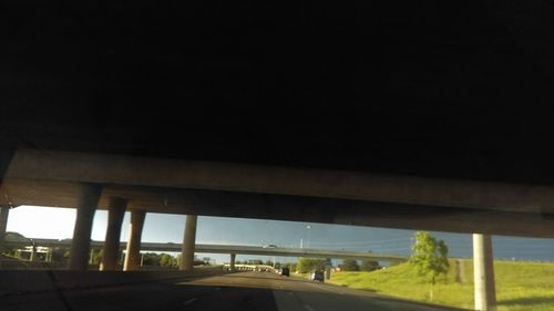 Car moving on highway against clear sky