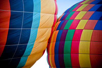 Low angle view of hot air balloon against blue sky