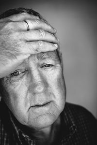 Close-up portrait of man making face at home