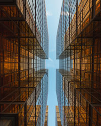 Directly below shot of modern buildings against sky