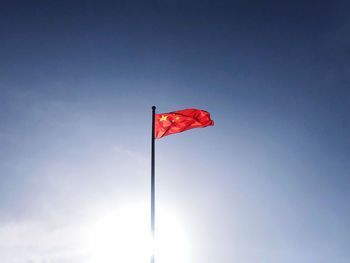 Low angle view of flag against sky