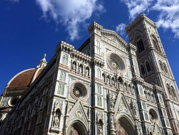 Low angle view of cathedral against cloudy sky