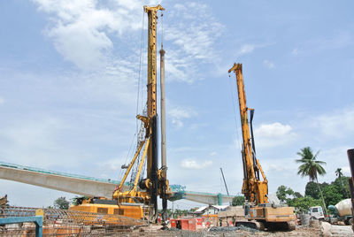 Low angle view of construction site against sky