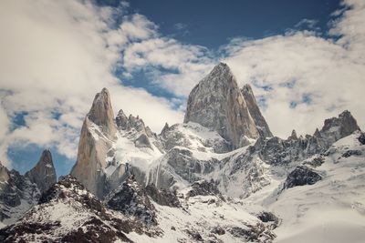 Panoramic view of snowcapped mountains against sky