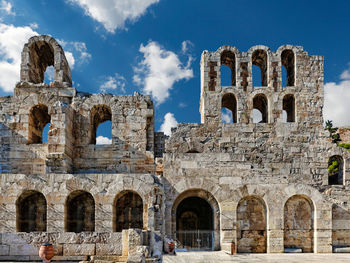 Old ruins of building against cloudy sky