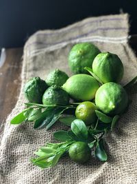 Close-up of limes on burlap