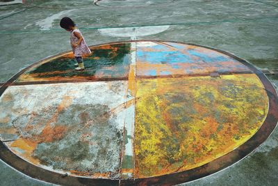 High angle view of girl standing on sports court