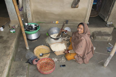 High angle portrait of woman preparing food at home