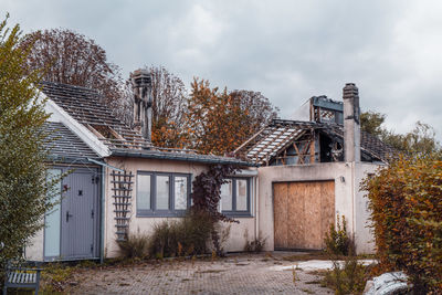 Exterior of burnt building against sky