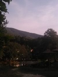 Scenic view of landscape against sky at dusk