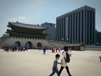 Tourists in front of building