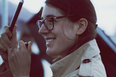 Close-up of smiling woman looking away