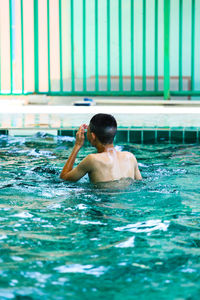 Man swimming in pool