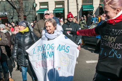 People standing on street in city