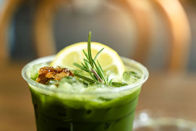 Close-up shot of delicious honey lemon green tea drink