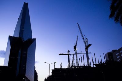 Low angle view of built structure against clear blue sky