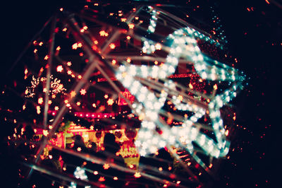 Close-up of illuminated christmas lights at night