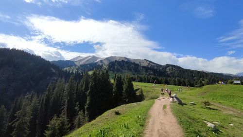 Panoramic view of road amidst mountains against sky