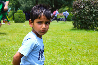 Portrait of boy in field