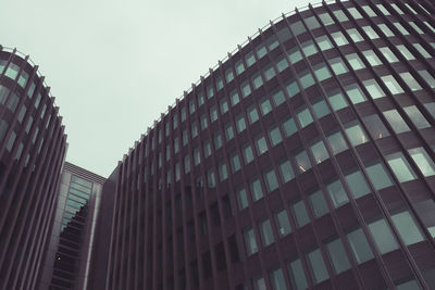Low angle view of modern buildings against clear sky