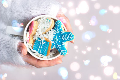 Cropped hands of woman holding sweet food