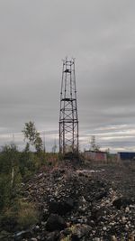 View of abandoned building against cloudy sky