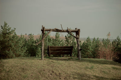 Abandoned built structure on field against clear sky