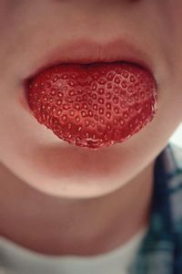 Close-up of strawberry in mouth