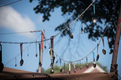 Low angle view of hanging against sky