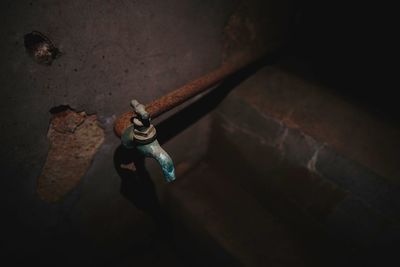 High angle view of old faucet on wall