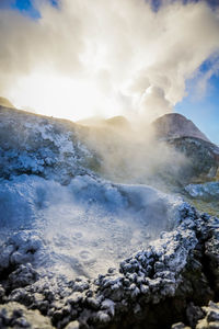 Steam emitting from geyser