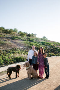 Family and dogs dressed up and posing for photos in southern californi