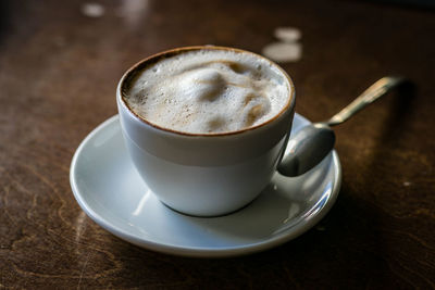 Close-up of coffee cup on table