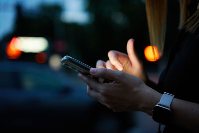 Close-up of man using mobile phone