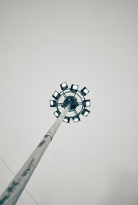 Low angle view of illuminated street light against sky