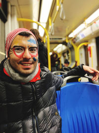 Portrait of man smiling  at the carnival in cologne. it was taken on the subway in germany