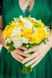 Close-up of woman holding bouquet