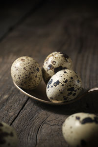 Quail eggs on a wooden table.