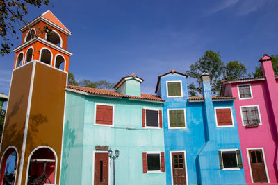 Low angle view of building against blue sky