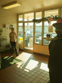 Man standing by window