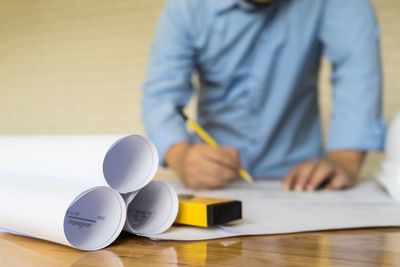 Close-up of man working on table