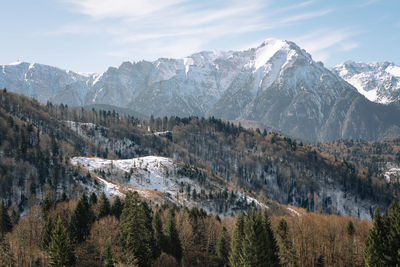 Scenic view of winnter landscape and mountains against sky