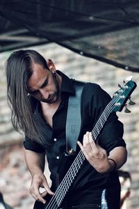 Full length of man playing guitar