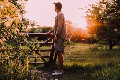 Full length of man standing on field against sky